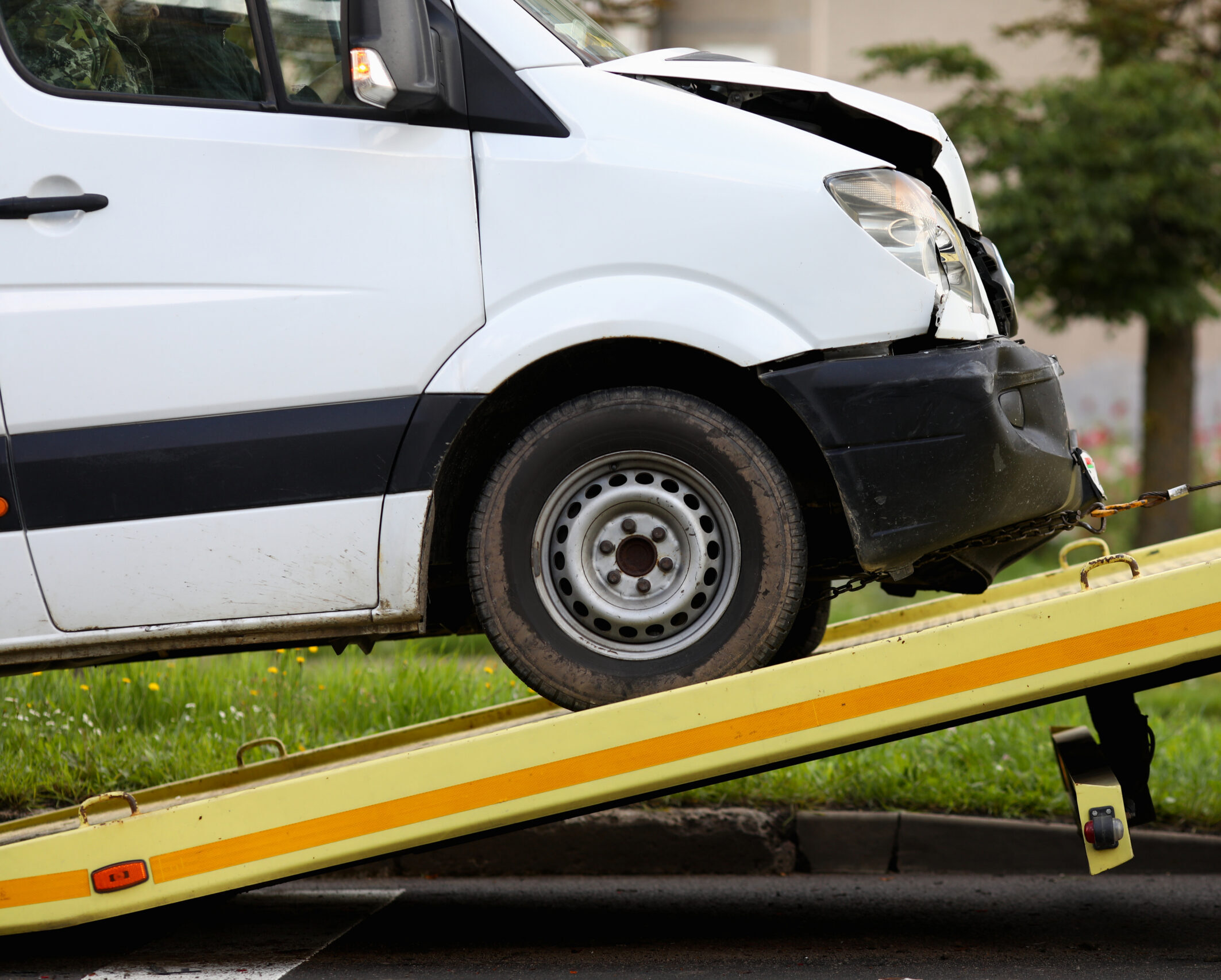 Crashed car is immersed in tow truck closeup